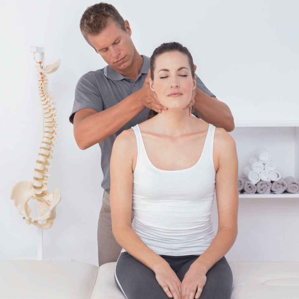 Chiropractor Bromley providing hands-on spinal adjustment to a patient in a treatment room