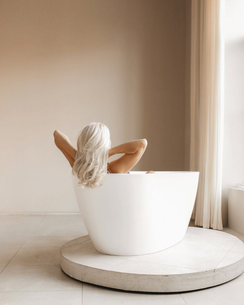 Patient smiling after treatment with top London chiropractor Penge, experiencing improved posture and energy