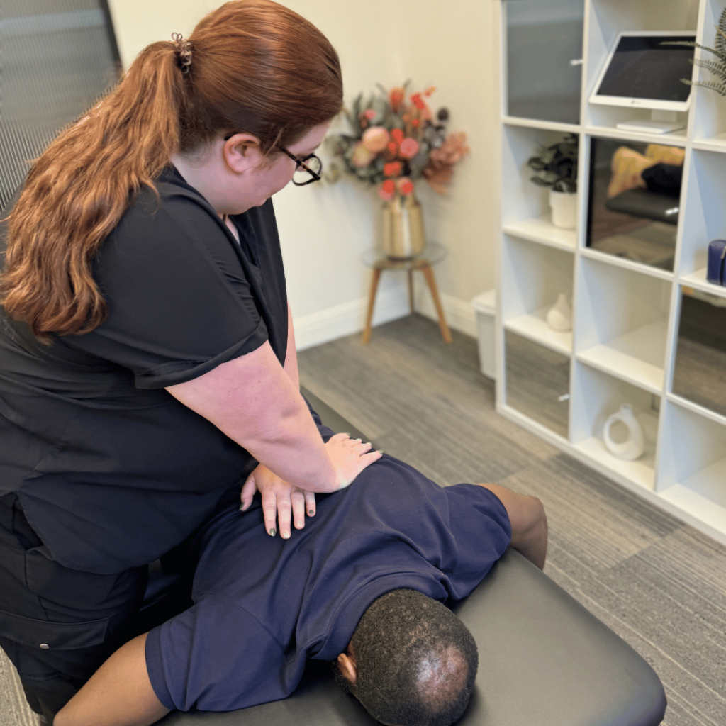 Top Rated Chiropractor at Bromley and Chislehurst Chiropractic giving a great treatment to one of our patients in our beautiful clinic room.